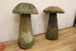 A pair of textured staddle stones, with circular tops and tapering bases, H.2ft 5in. Starting Price: