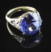 A 1920`s gold, diamond and synthetic sapphire set dress ring, with diamond chip set shoulders,