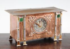 An Arts & Crafts silvered metal and copper mantel timepiece, with applique inset Scottish rose