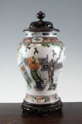 A Chinese famille verte baluster vase, late 19th century, painted with Long Eliza figures and a