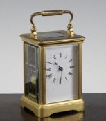 An Edwardian gilt brass carriage clock, with enamelled Roman dial, 5.5in.; associated travelling