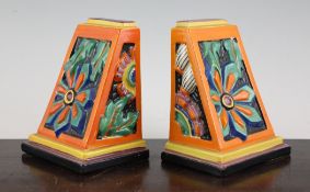 A pair of Clarice Cliff `Floreat` bookends, printed facsimile signature and Fantasque marks, 6.