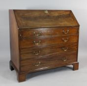 A George III mahogany bureau, fall front over four graduated drawers, on bracket feet, W.3ft 6in.