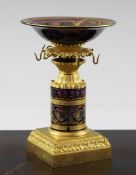 A late 19th century French ormolu and amethyst glass ring stand, the circular bowl and central