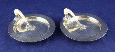 A pair of 1930`s ivory handled silver ashtrays, designed and executed by Charles Boyton for Alfred