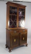 A George III design mahogany and rosewood crossbanded bookcase, with a pair of astragal glazed doors