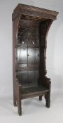 A 19th century carved oak gothic bishop`s chair, W.2ft 8in. H.6ft 8in. Starting Price: £256