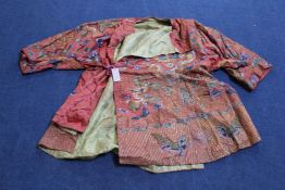 A Chinese embroidered silk and metal thread `dragon` robe, decorated with dragons, bats, deer and