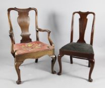 A mid 18th century walnut elbow chair, with vase shaped splat and drop in seat, on cabriole legs,