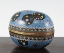 A Chinese cloisonne enamel egg shaped box and cover, decorated with black ground floral medallions