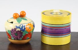 Two Clarice Cliff preserve jars and covers, the first cylindrical decorated with an original Bizarre