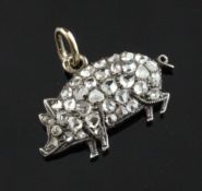 An Edwardian gold silver and diamond encrusted pendant, modelled as a pig, 0.75in. Starting