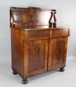 A Victorian mahogany chiffonier, with two frieze drawers and two panelled doors, on bun feet, W.