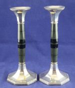 A pair of 1920`s Art Deco silver mounted stained wood or perhaps bakelite candlesticks, with