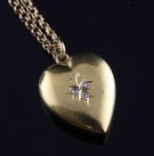 An Edwardian 15ct gold and diamond set heart shaped pendant, 0.75in, on an unmarked double link