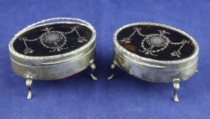 A pair of George V silver and tortoiseshell pique oval trinket boxes, decorated with harebell