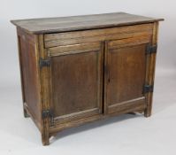 An 18th century oak cupboard, with two panelled doors enclosing a shelf, W.3ft 6.5in. Starting