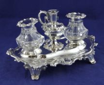 An ornate early Victorian inkstand, of shaped oval form, with pierced border and central