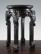 A Chinese rosewood and marble inset stand, late 19th century, with leaf and gourd carved frieze, the