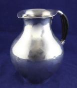 A 1920`s Georg Jensen sterling silver pitcher, designed by Jorgen Jensen, design no.385, of curved