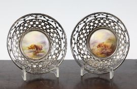 A pair of Royal Worcester silver mounted bon bon dishes, c.1912 the circular plaques to the centre