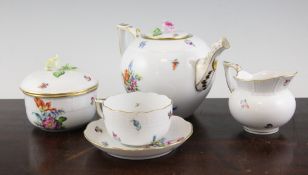 A Herend seventeen piece porcelain tea set, each piece with osier moulded band and hand painted with