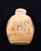 A Chinese Hornbill snuff bottle, one side carved in relief with a female figure on a raft, the other