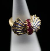 A 1950`s? gold, ruby and sapphire set dress ring, of geometric fan design, size M. Starting