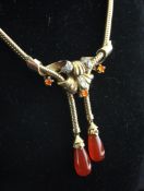 A stylish 1940`s/1950`s French? gold, diamond and agate drop pendant necklace, of scrolling form,