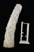 A West African ivory tusk, carved with figures, 11in. and a square sectional ivory stand Starting