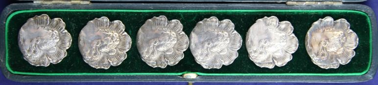 A cased set of six Edwardian Art Nouveau silver buttons, of flowerhead shape, each embossed with the