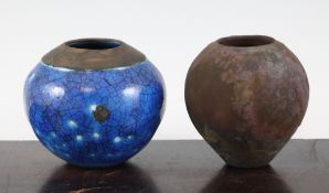 Judith Fisher. Two small stoneware vases, the blue raku glazed globular pot with unglazed top rim,