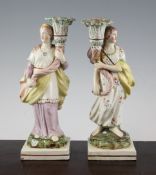A pair of Pearlware figural candlesticks, c.1820, each modelled as a maiden in classical dress,