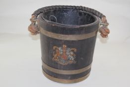A 20th century brass bound fire bucket, with a leather covered twisted rope handle decorated with