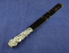 A Victorian silver mounted tortoiseshell page turner, the handle modelled as the fictional comic