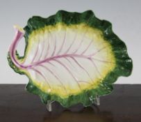 A Chelsea cabbage leaf dish, c.1756, the moulded leaf picked out in puce, yellow and green