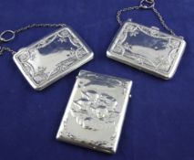 An Edwardian repousse silver card case, of rectangular form, with button release hinged lid and