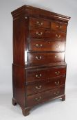 A George III mahogany chest on chest, with swing brass handles, on bracket feet, H.6ft Starting