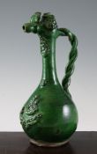 An Ottoman canakkale green glazed pottery ewer, Turkey, 19th century with applied decoration,