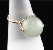 A 20th century 18ct gold and jadeite ring, of globe form, size O. Starting Price: £120