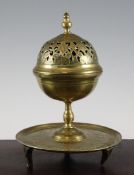 An Islamic spherical pierced brass incense burner, possibly Ottoman, 18th century, with circular