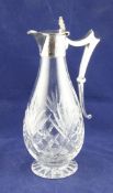 An Edwardian silver mounted cut glass claret jug, of pear form, with shaped angular handle and
