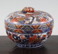 A Japanese Imari compressed globular bowl and cover, Edo period, painted with peonies, rockwork