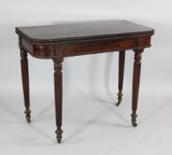 A William IV mahogany folding top tea table, with cotton reel mouldings and tapering gadrooned legs,