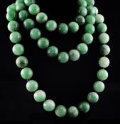 A single strand large jadeite bead necklace, 48in. Starting Price: £240