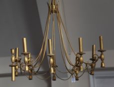 A continental brass ten light hanging electrolier, with beaded swag decoration, 2ft 8in. Starting