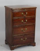 A small George III style mahogany chest, of four graduated drawers with brushing slide, on bracket