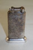 A Dunhill shagreen and silver plated table lighter, with weighted base, 4in. Starting Price: £120
