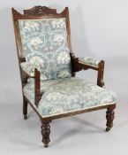 A late Victorian carved walnut armchair with William Morris fabric Starting Price: £96