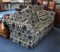 A modern two piece suite, with shaped arms and brocade upholstery, Starting Price: £80